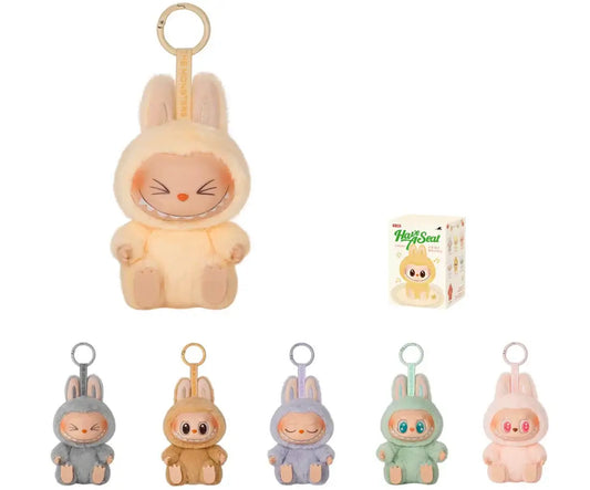 Adorable Pop Mart Labubu collectibles featuring Sisi vinyl plush bunnies in various colors with a charming box.