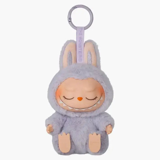 Cute Pop Mart Labubu Zizi toy, part of 'The Monsters Have A Seat' series, featuring Labubu's friend Zizi in a cozy, relaxed pose.