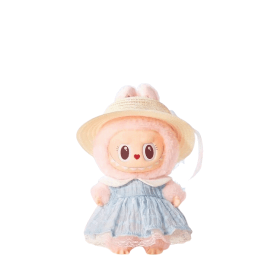Cute plush doll in a blue dress and straw hat, featuring bunny ears and big expressive eyes.